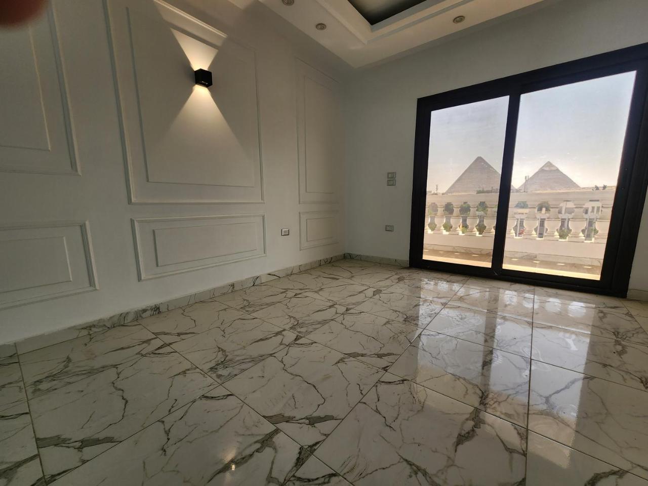 Prime Location Apartment with Unobstructed Giza Pyramids View & Easy City Access